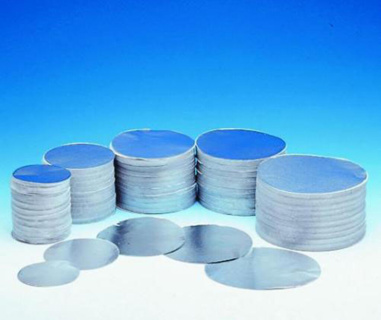 Round aluminium discs, interle aved with tissue pa